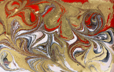 Marble abstract acrylic background. Red marbling artwork texture. Agate ripple pattern. Gold powder.