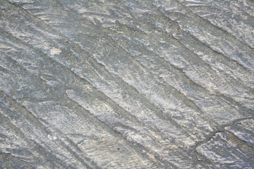 Stone texture near waterfall natural grey background