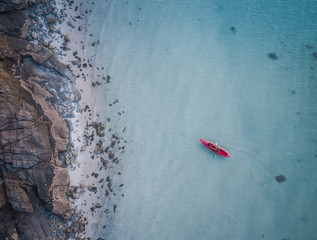 Ocean Kayaing Near Rocky Coastline