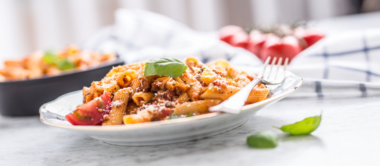 Italian food and pasta pene with bolognese sause on plate