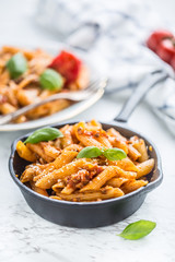 Italian food and pasta penne with bolognese sause in pan