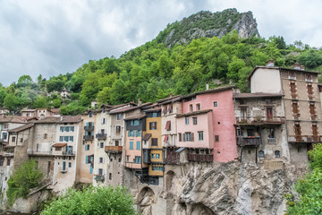 Fototapeta na wymiar Pont-en-Royans in the Vercors, typical colorful houses built on the cliff, over the river, in France 