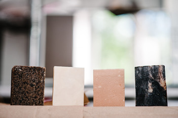 A set of organic natural cosmetics of body care: fragrant handmade spa soap on a blurry background. Soap making. Soap bars closeup. Spa treatments, skin care concept. Place for text and advertising.