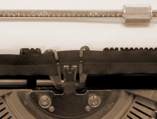 empty by the old typewriter on white paper with sepia toned