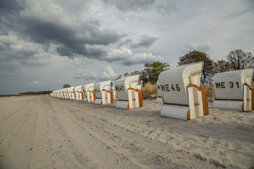View to Beach chairs in one row at Baltic Sea Beach at Kuehlungsborn / Germany