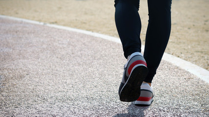 Fototapeta na wymiar Appearance from behind of the women's running legs.