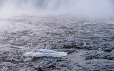 Freezing winter morning at Kuusaankoski rapids. Sun is rising. Temperature -22 °C. Laukaa, Finland.