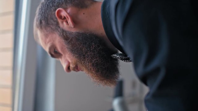 Bearded Tailor Designer is Making a Pattern on the Fabric before Sew Fashionable Clothes