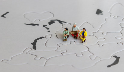 Miniatures on the world map puzzles.