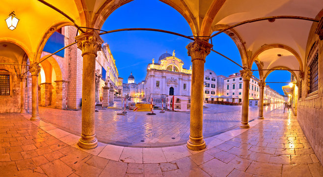 Fototapeta Stradun in Dubrovnik arches and landmarks panoramic view at dawn