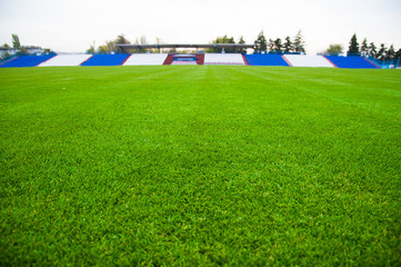 Obraz premium Outdoor stadium with green grass