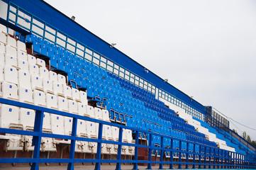 Obraz premium Empty white and blue seats in stadium