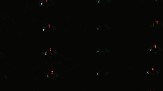 ceiling with built-in halogen lamps, switching on slowly in darkness