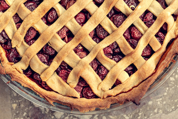 Tart with cherries. Delicious cake baked in a home kitchen. Shallow depth of field.