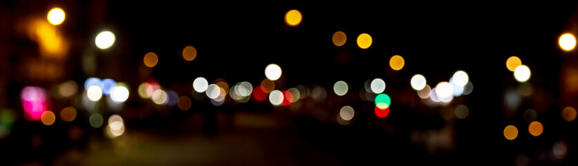Bokeh traffic light at night in the street of a big city © sdecoret