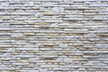 Fototapeta premium The surface pattern of wall decoration with gray stone.