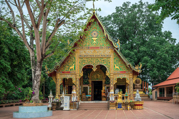entrance to buddhist temple with decorative geometric ornaments with gemstones