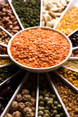 Indian Beans,Pulses,Lentils,Rice and Wheat grain in a white Sunburst or sun rays shape designer...