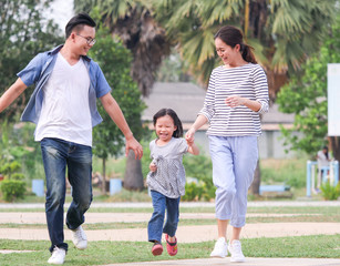 Happy family playing in the park.