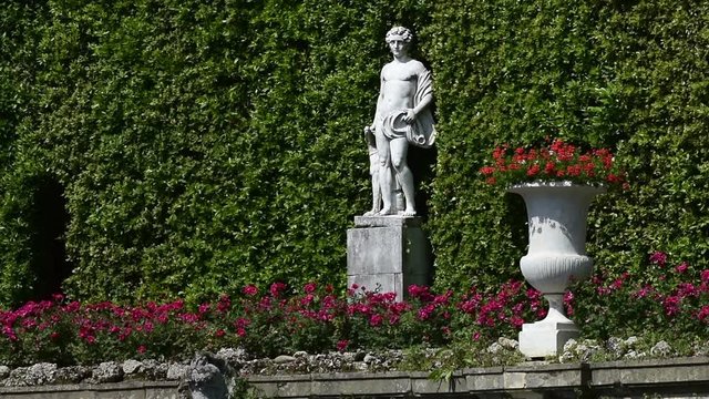 The Theatre of Water of Villa Reale in Marlia, with stone fountains, statues and beautiful roses flower beds.