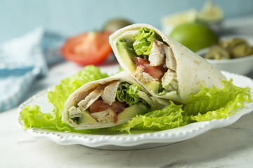 Homemade chicken, tomato and avocado wrap