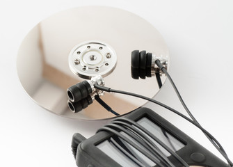 Metal earphones on a disk