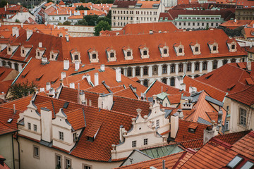 Fototapeta na wymiar Beautiful traditional houses with orange tiled roofs in Prague in the Czech Republic