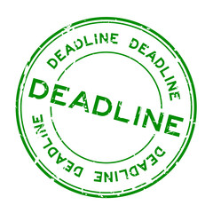 Grunge green deadline round rubber seal stamp on white background