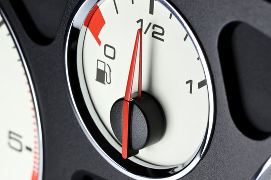 fuel gauge in car dashboard - half full