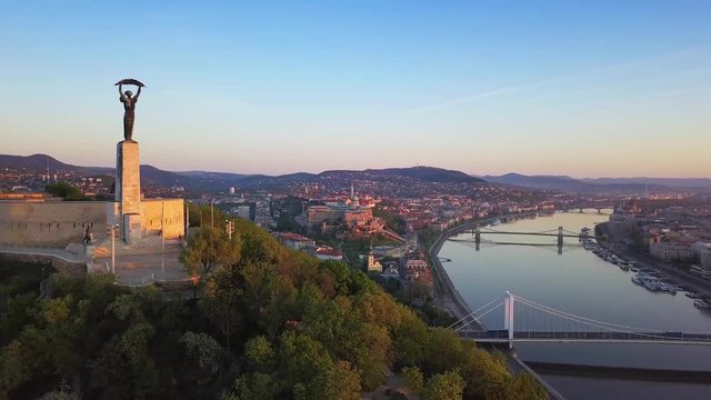 Budapest, Hungary - 4K Aerial skyline view of Budapest with Gellert Hill, Statue of Liberty and Buda Castle at sunrise