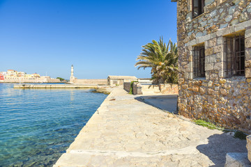 Historical harbor buildings and lighthouse in the venetian port of Chania  © ksl
