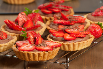 Homebaked Strawberry Tartlets With Ganache. Decorated.