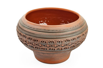clay ethnic dishes on white background