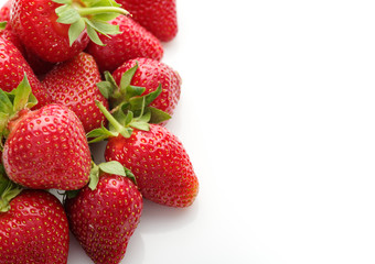Fresh natural strawberries on white background with place for text. Copyspace