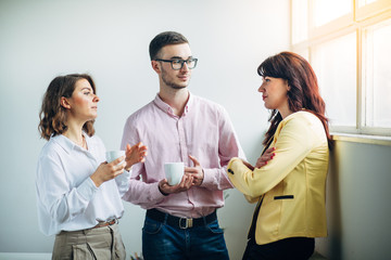 Colleagues chatting at office
