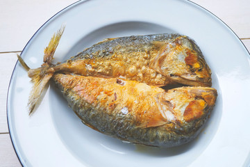 Fried Mackerel on a white plate
