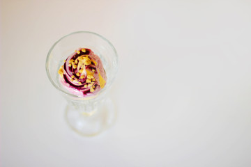 Sweet blueberry and melon icecream in the glass on the white background