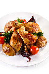 Grilled drumsticks with baked potatoes white background