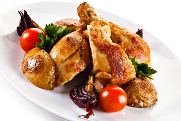 Grilled drumsticks with baked potatoes white background