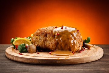 Stuffed pork chop with boiled potatoes and vegetables