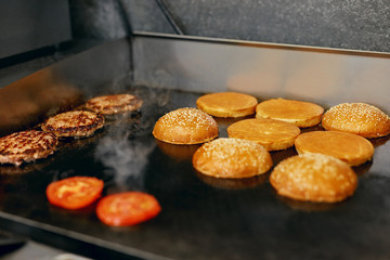 Cooking Burgers.  Meat And Buns Roasting On Grill 