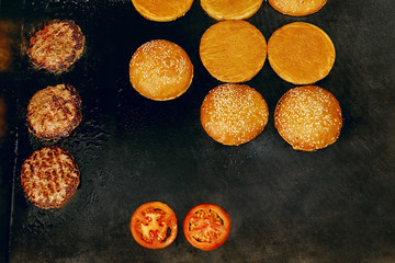Cooking Burgers.  Meat And Buns Roasting On Grill 