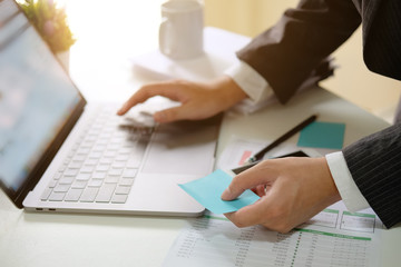 Businessman working with digital computer in modern office with virtual icon diagram at modern office in morning light