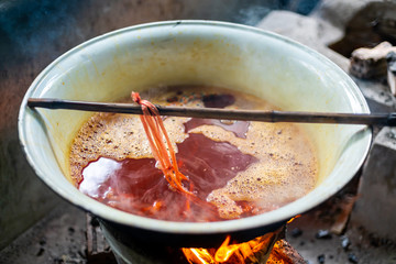 Boiling Fabric in the Pot to Natural Tie and Dye a Procedure to make Mudmee or Ikat Weaving