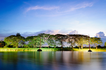 Obraz premium A small lake in summer , at sunset