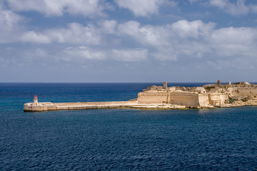Photo of Mediterranean Sea, view from Valletta, Malta. Blue cloudy sky as background.