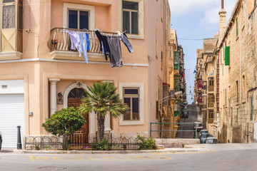 Photo of Typical street of Malta, ancient buildings and architecture