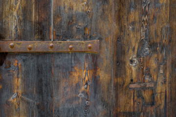 Photo of Old rustic wood texture with metal parts, perfect for a background