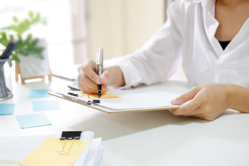 Business woman working at work table,home office desk background, Desk musicians,checklist planning...