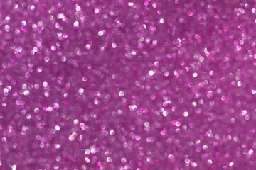 abstract bright purple bokeh lights background , defocused background